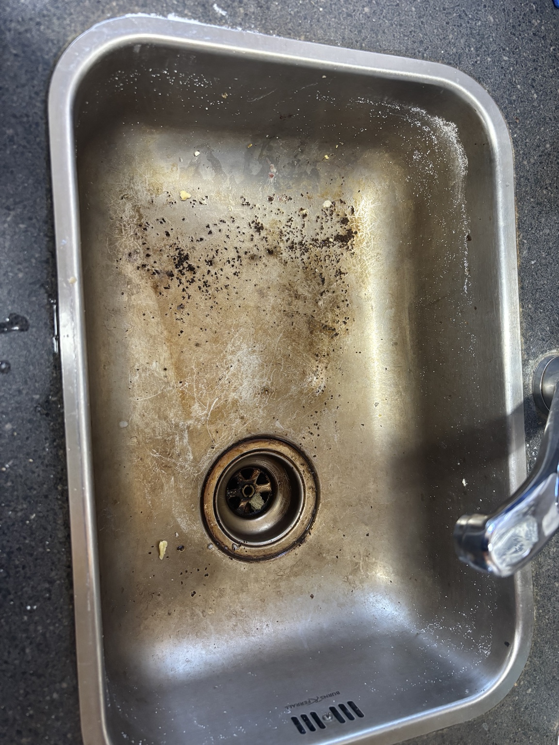 Stainless steel sink before specialist cleaning
