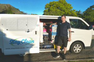 Senior upholstery cleaning technician Patrick Greig with Stay Clean & Restoration service van in Christchurch